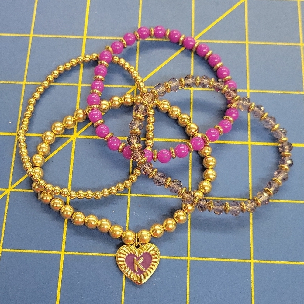 Gold Tone & Purple Beaded 4 Strand Stretch 7.5" Bracelets w K in a Heart Charm